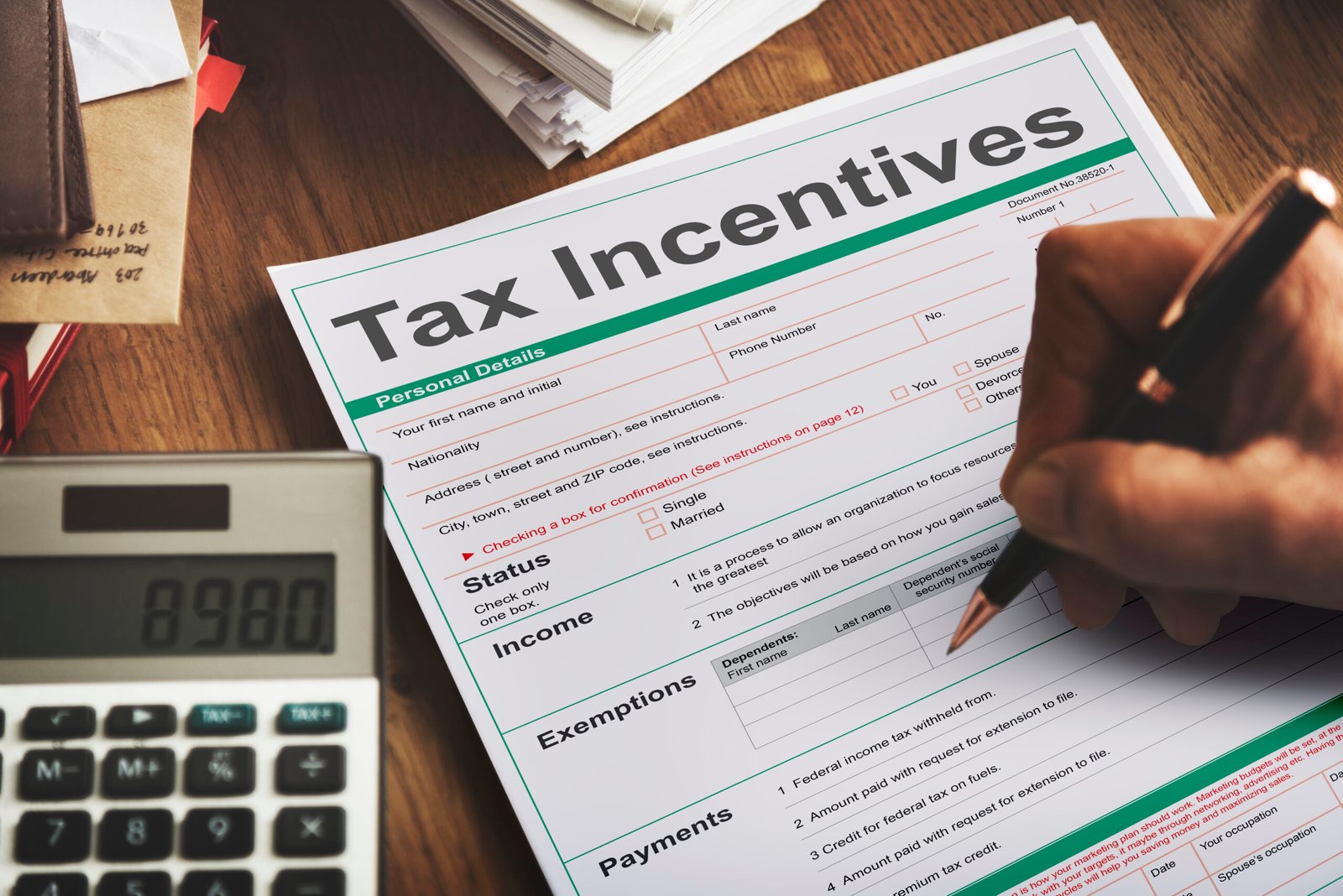 Tax incentive form on a desk with a calculator